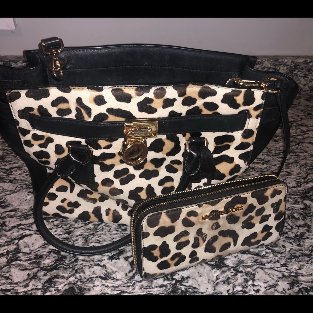 Michael Kors leopard purse and matching wallet.